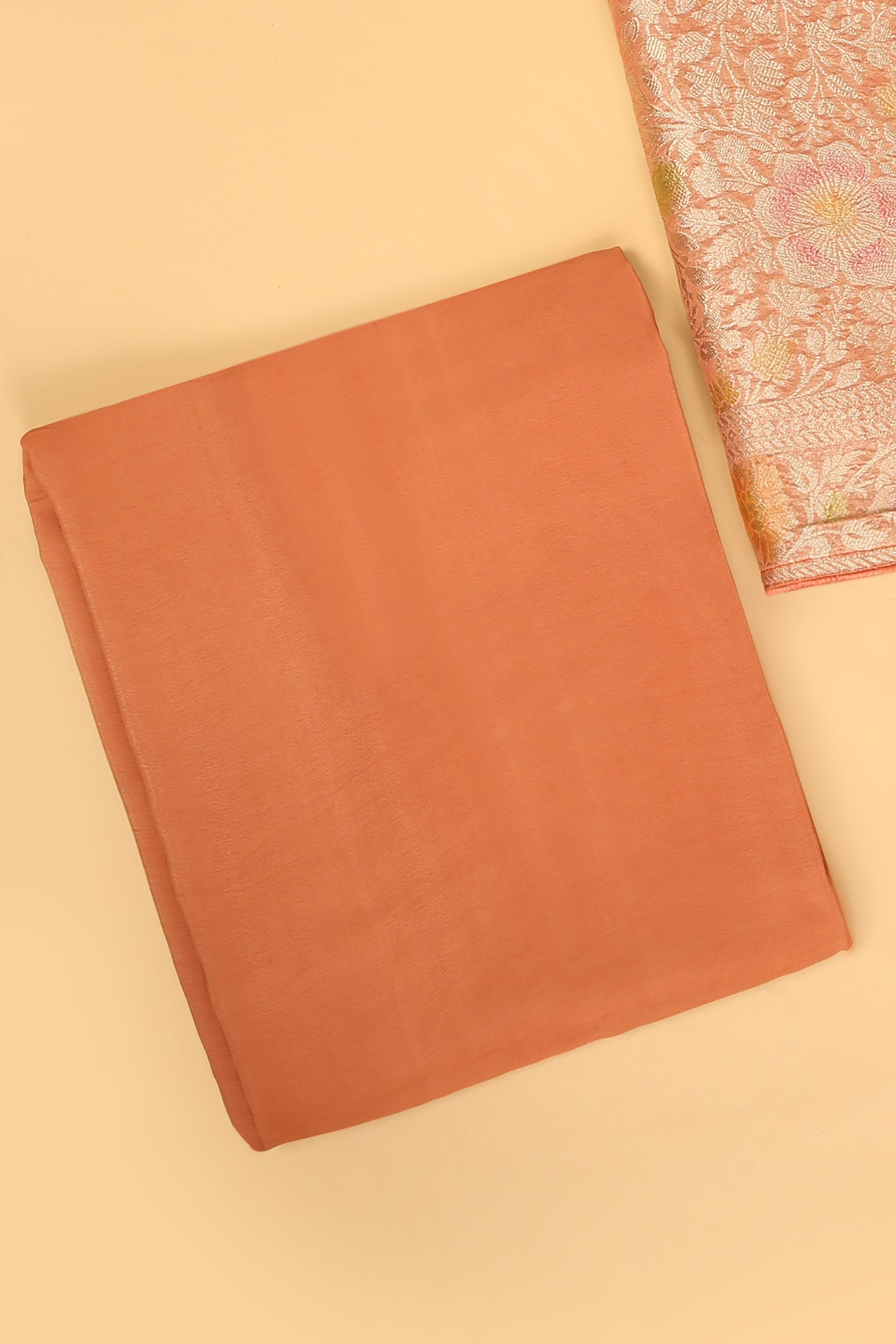 Peach Khaddi Georgette Silk Suit in Floral Jaal pattern on shirt and Rangkaat on shirt and dupatta with plain crepe silk bottom