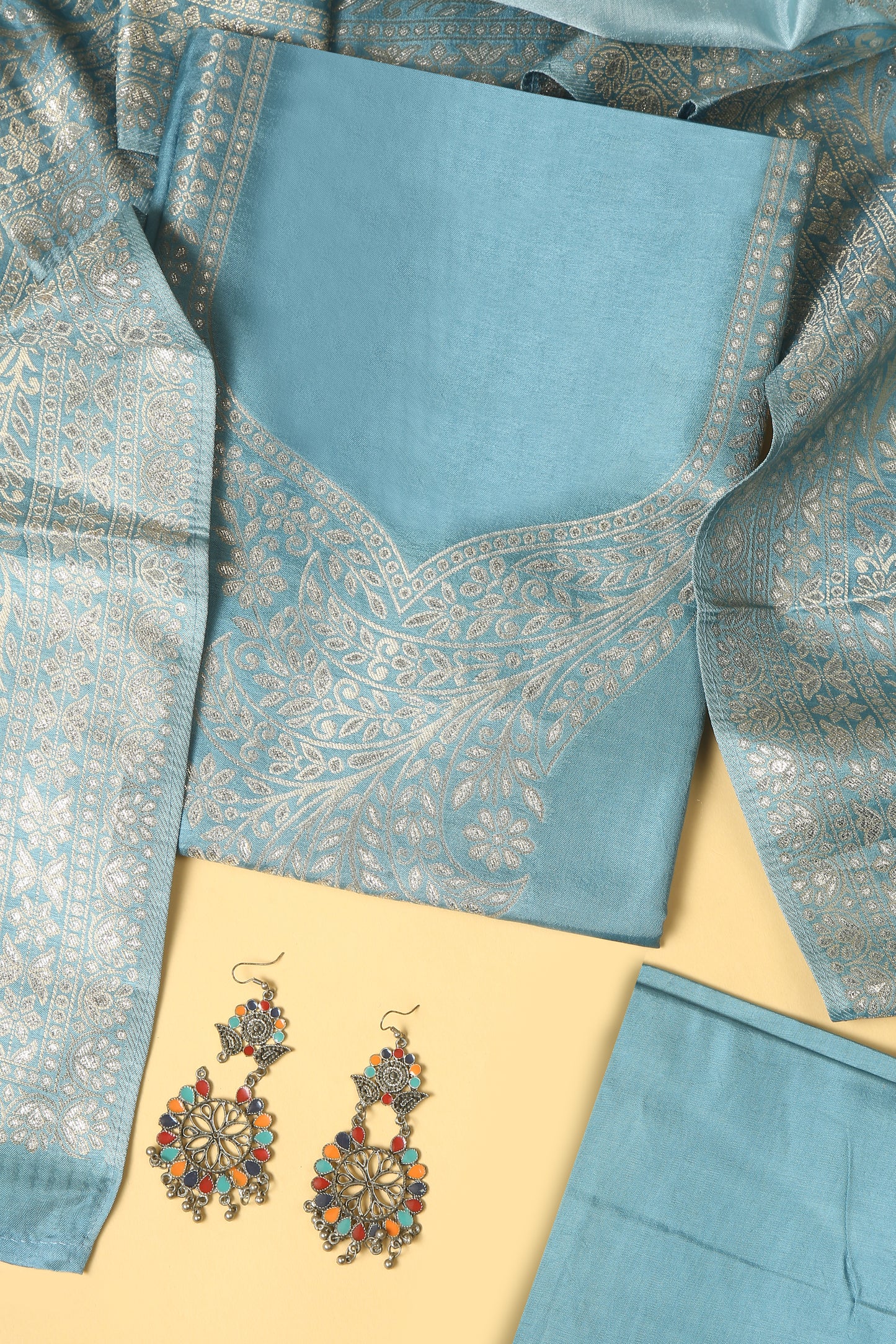 Blue Chanderi Silk suit in Neck Design and tradtional motifs on body woven with golden zari and Ombre motif weaved Dupatta giving subtle contrast with shirt