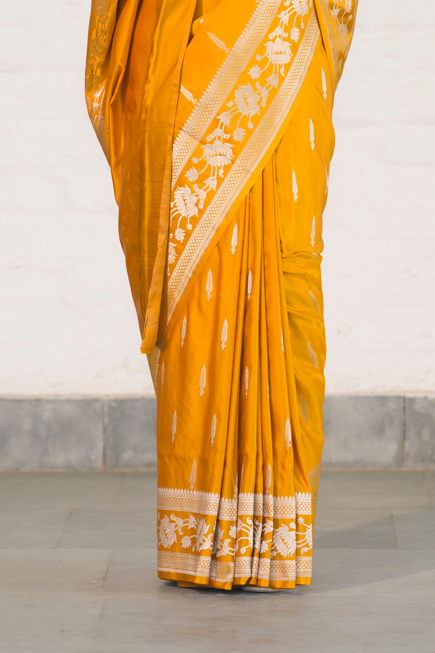 Yellow Mashru Silk Saree woven in Leaf inspired butis across body paired with Floral bel border