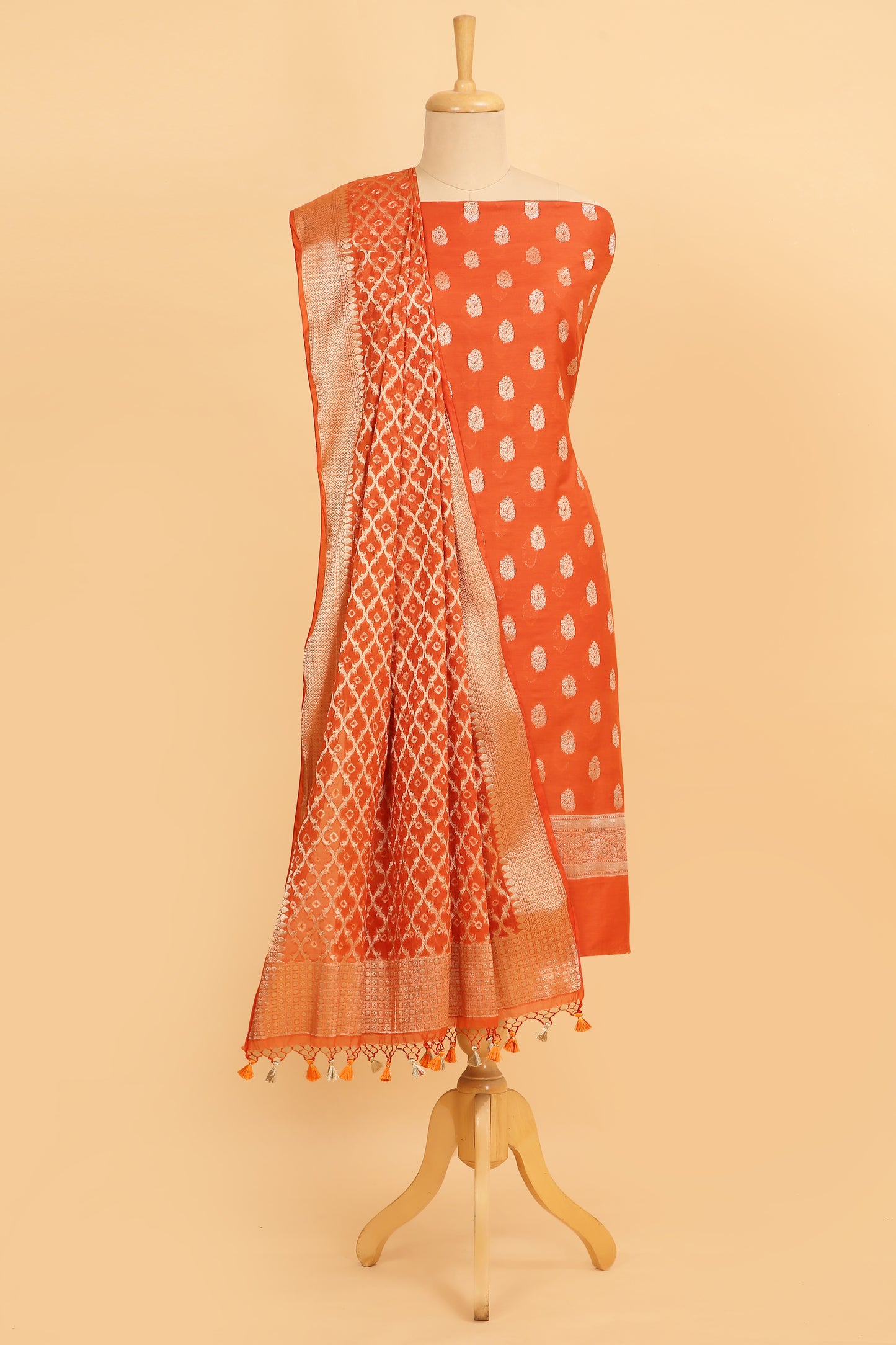 Orange Banarasi Chanderi Silk unstitched suit set in Zari Buti woven shirt with Bandhani and woven dupatta