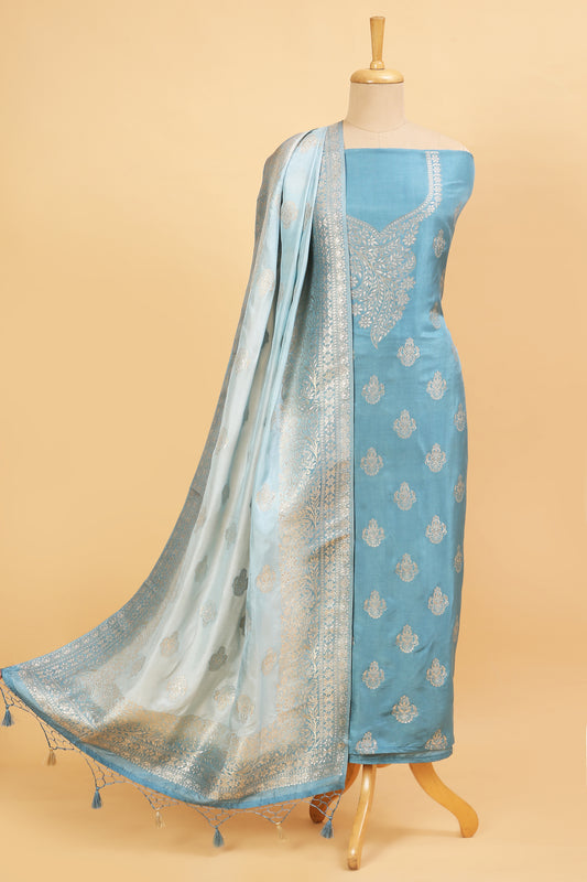Blue Chanderi Silk suit in Neck Design and tradtional motifs on body woven with golden zari and Ombre motif weaved Dupatta giving subtle contrast with shirt