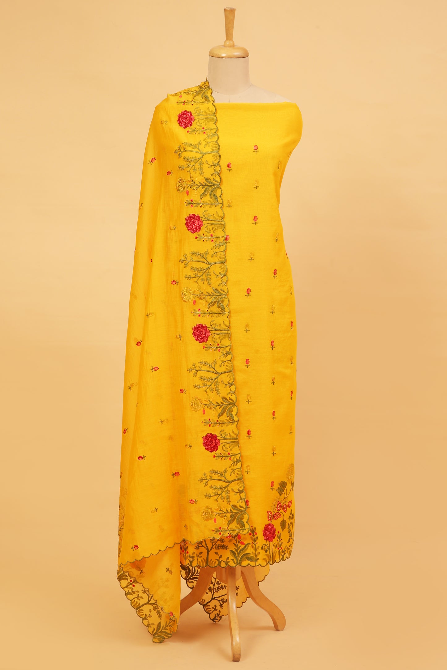 Yellow Mul Chanderi unstitched suit set with multi color embroidery on shirt and dupatta with scallop work
