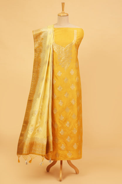 Yellow Chanderi Silk suit in Neck Design and tradtional motifs on body woven with golden zari and Ombre motif weaved Dupatta giving subtle contrast with shirt