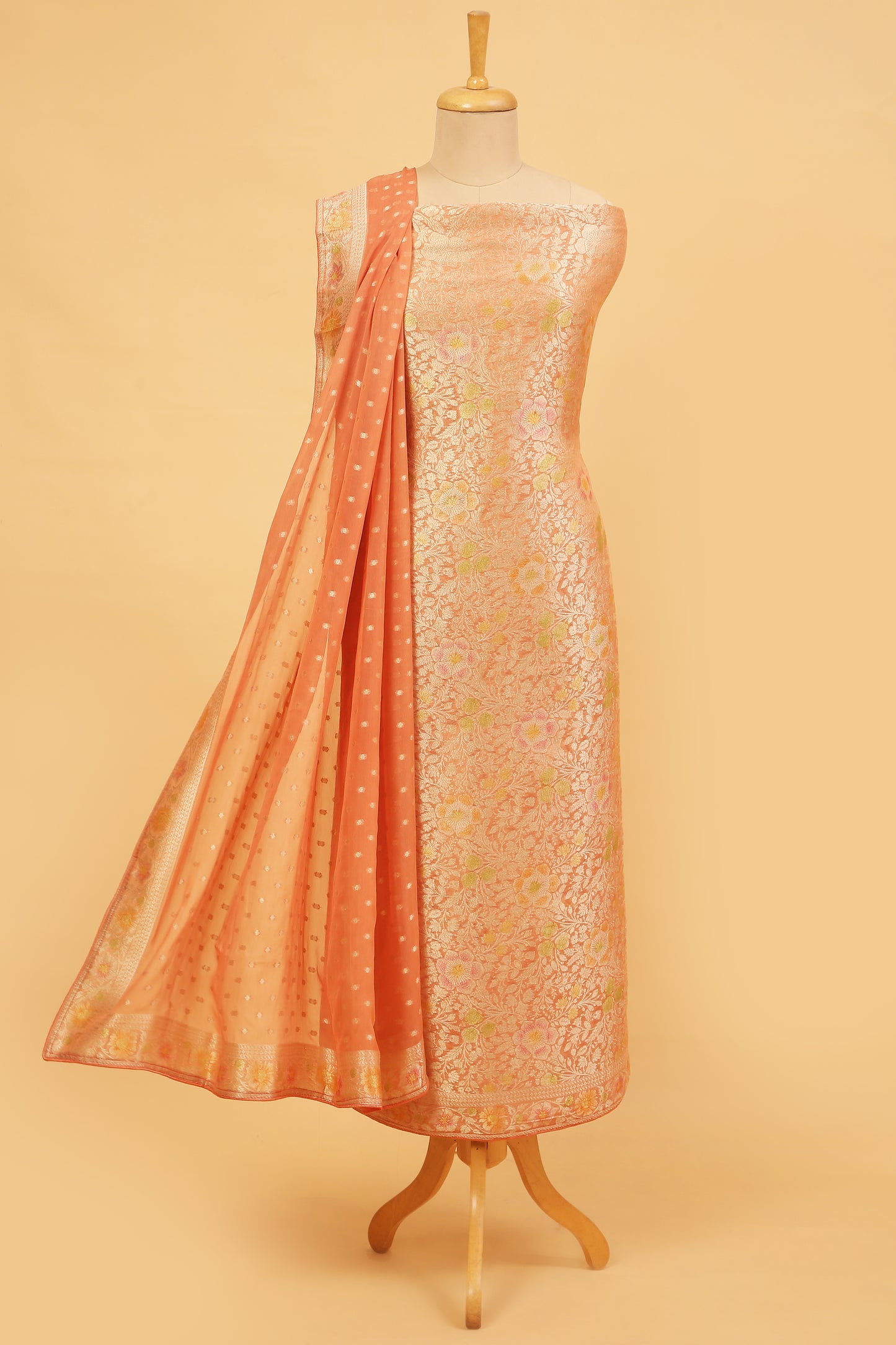 Peach Khaddi Georgette Silk Suit in Floral Jaal pattern on shirt and Rangkaat on shirt and dupatta with plain crepe silk bottom