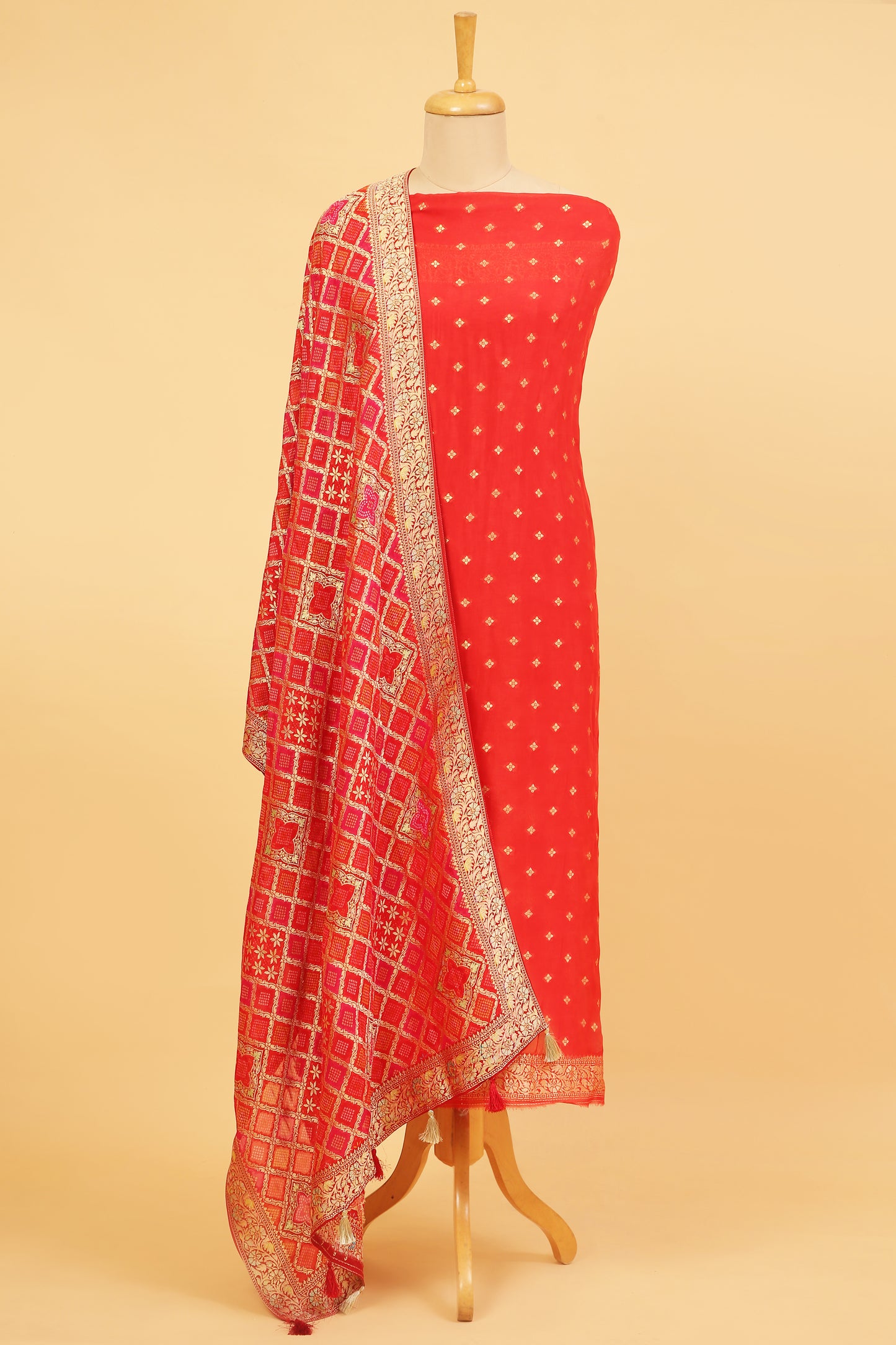 Rust orange Khaddi Georgette Silk Suit in small buti on shirt and Bandhani Weave dupatta with plain crepe silk bottom