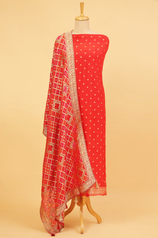 Rust orange Khaddi Georgette Silk Suit in small buti on shirt and Bandhani Weave dupatta with plain crepe silk bottom