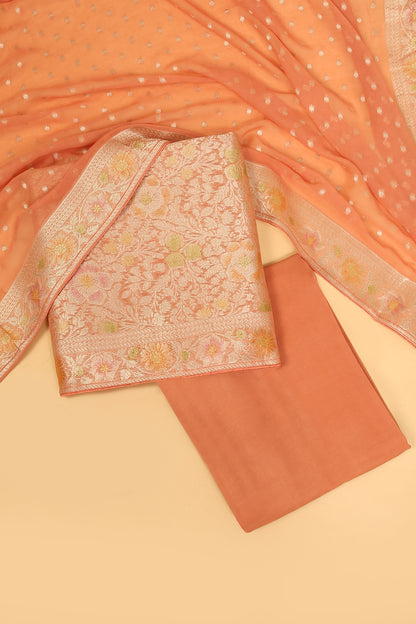 Peach Khaddi Georgette Silk Suit in Floral Jaal pattern on shirt and Rangkaat on shirt and dupatta with plain crepe silk bottom