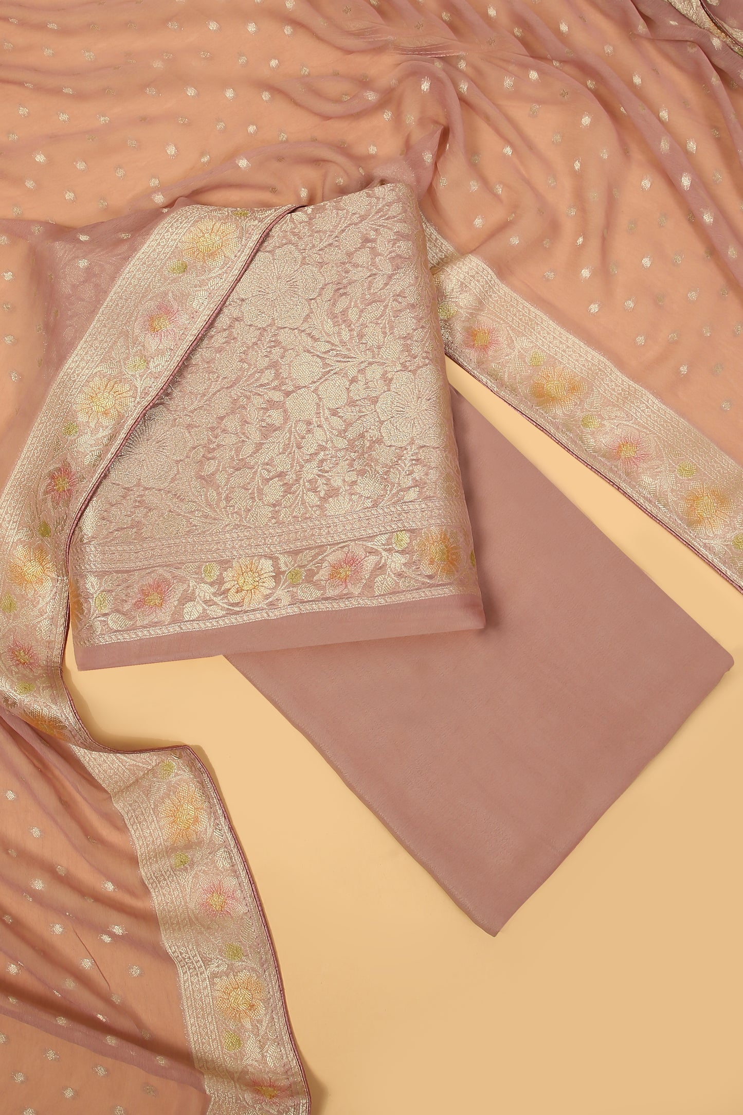 Mauve Khaddi Georgette Silk Suit in Floral Jaal pattern on shirt and Rangkaat on shirt and dupatta with plain crepe silk bottom