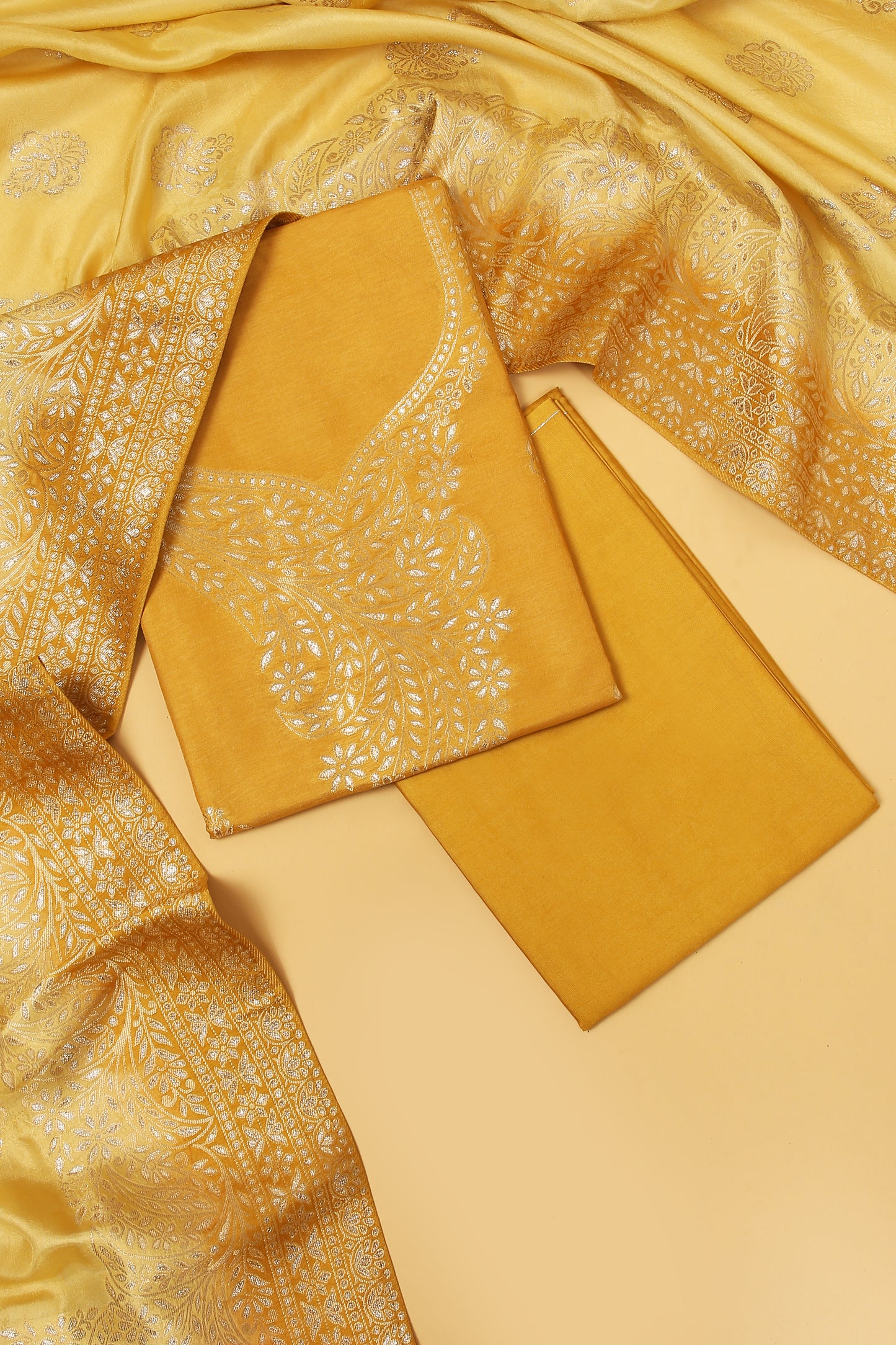Yellow Chanderi Silk suit in Neck Design and tradtional motifs on body woven with golden zari and Ombre motif weaved Dupatta giving subtle contrast with shirt