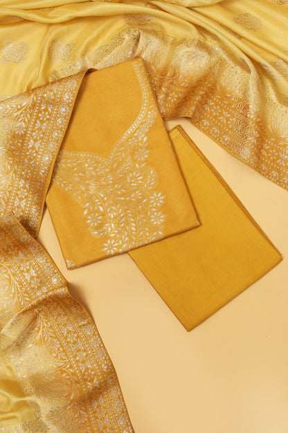 Yellow Chanderi Silk suit in Neck Design and tradtional motifs on body woven with golden zari and Ombre motif weaved Dupatta giving subtle contrast with shirt