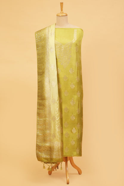 Green Chanderi Silk suit in Neck Design and tradtional motifs on body woven with golden zari and Ombre motif weaved Dupatta giving subtle contrast with shirt