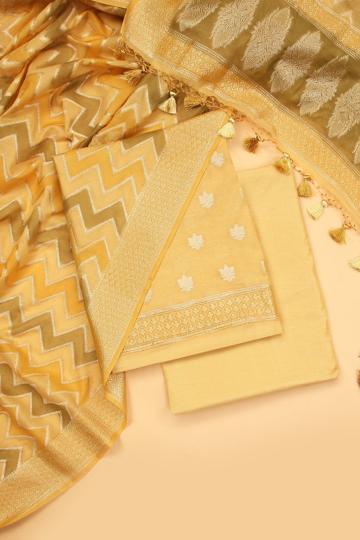 Light Yellow Banarasi Chanderi Silk unstitched suit set in Zari Buti woven shirt paired with Rangkaat and woven dupatta