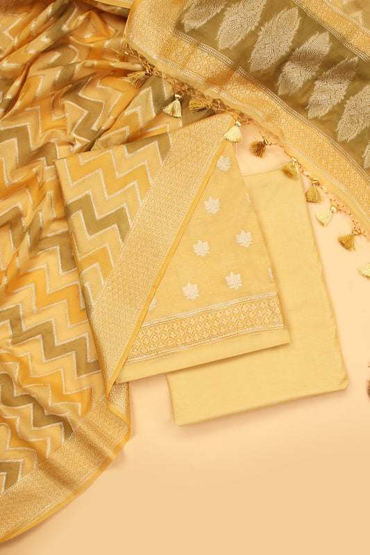 Light Yellow Banarasi Chanderi Silk unstitched suit set in Zari Buti woven shirt paired with Rangkaat and woven dupatta