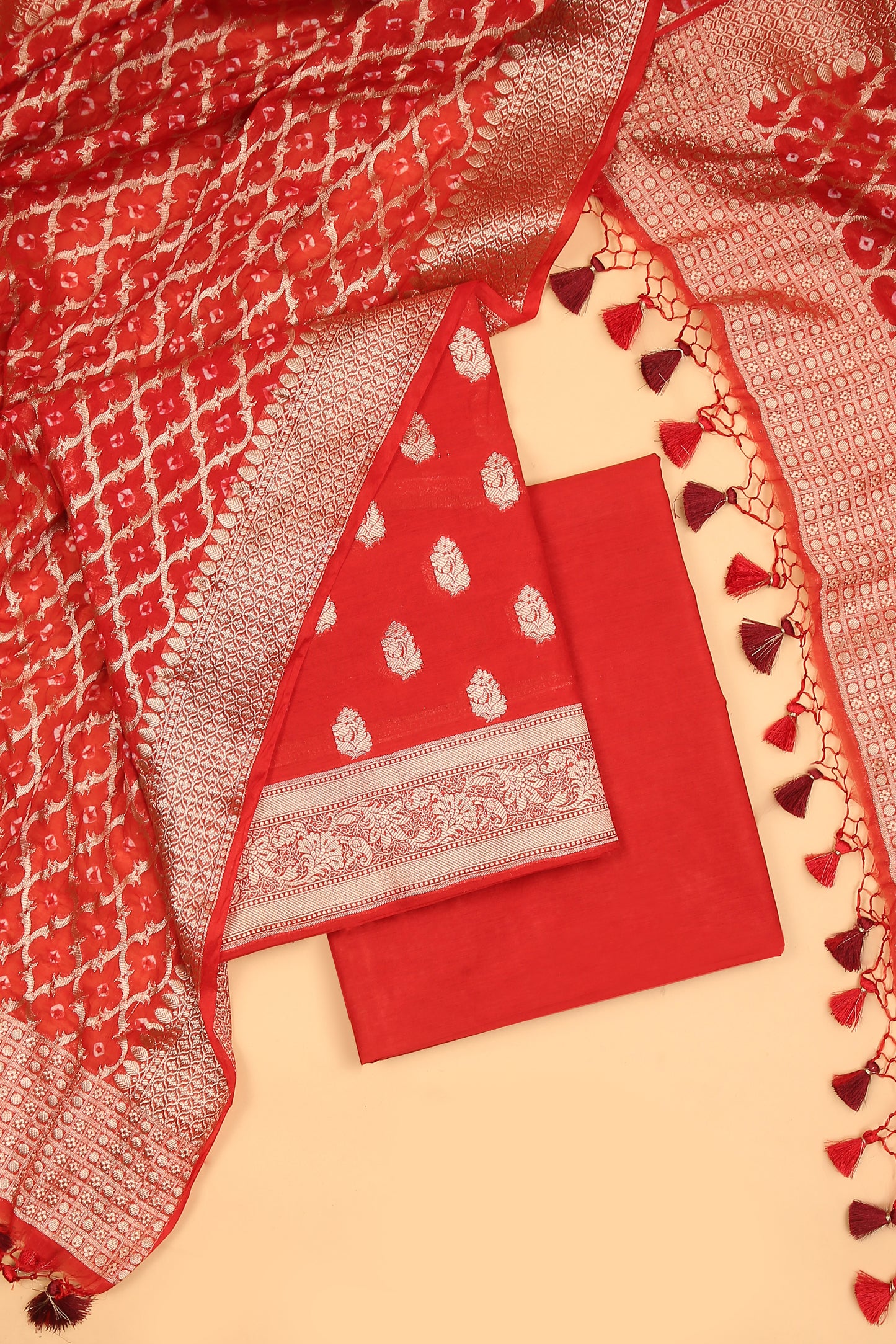 Red Banarasi Chanderi Silk unstitched suit set in Zari Buti woven shirt with Bandhani and woven dupatta