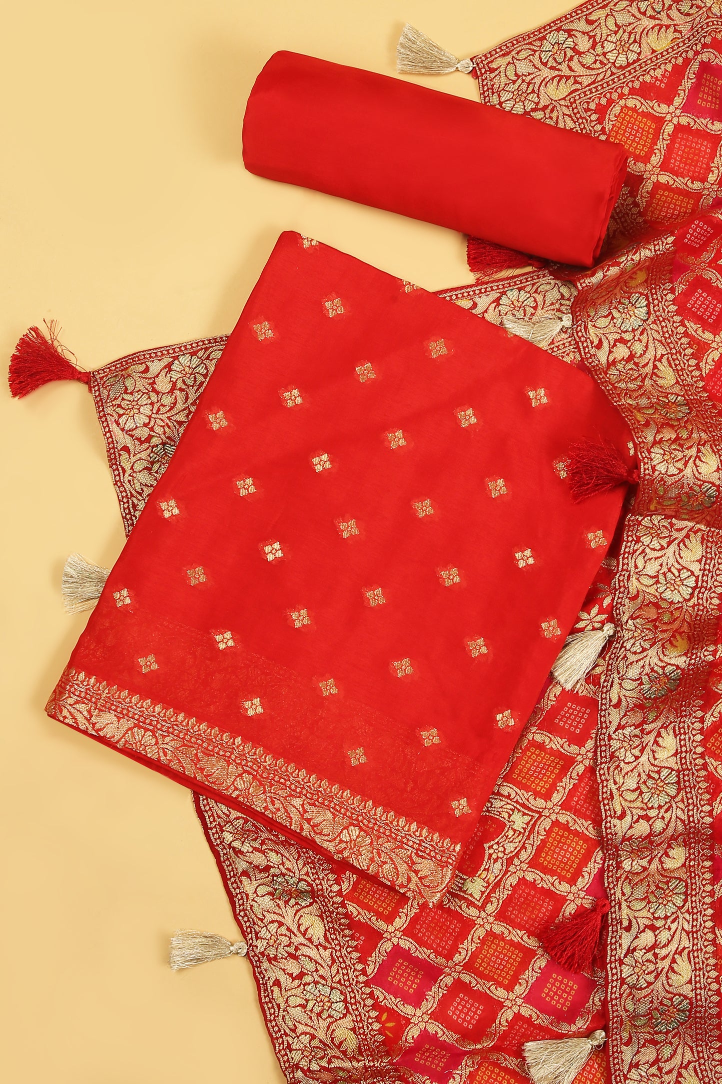 Rust orange Khaddi Georgette Silk Suit in small buti on shirt and Bandhani Weave dupatta with plain crepe silk bottom