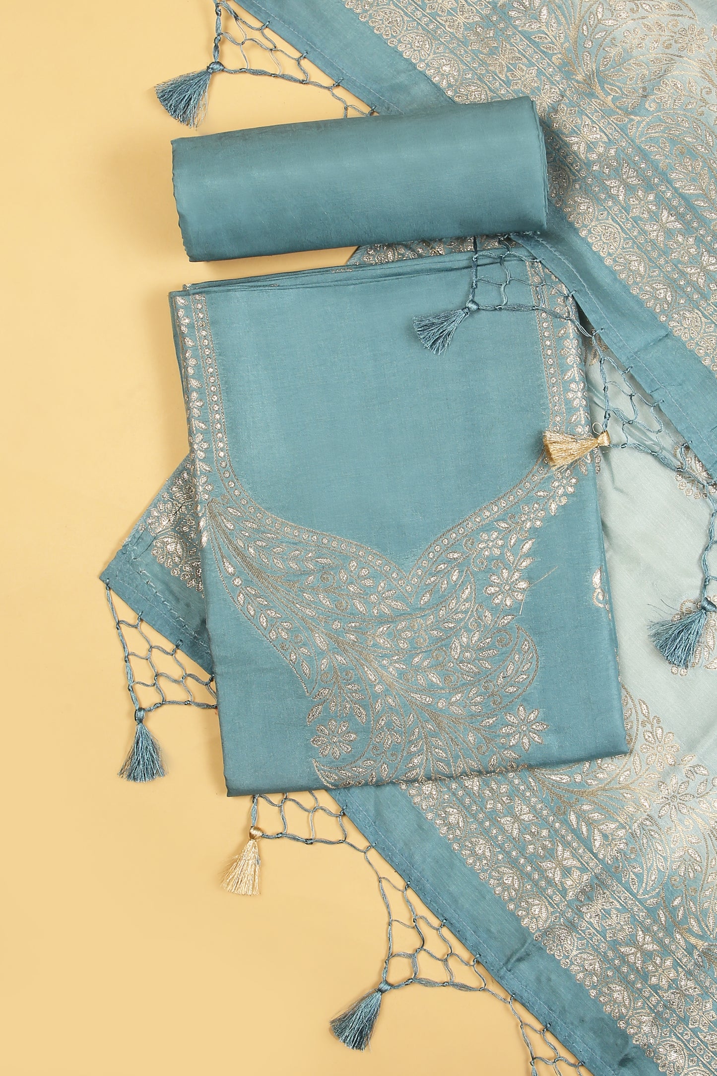 Blue Chanderi Silk suit in Neck Design and tradtional motifs on body woven with golden zari and Ombre motif weaved Dupatta giving subtle contrast with shirt