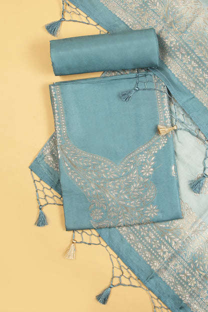 Blue Chanderi Silk suit in Neck Design and tradtional motifs on body woven with golden zari and Ombre motif weaved Dupatta giving subtle contrast with shirt