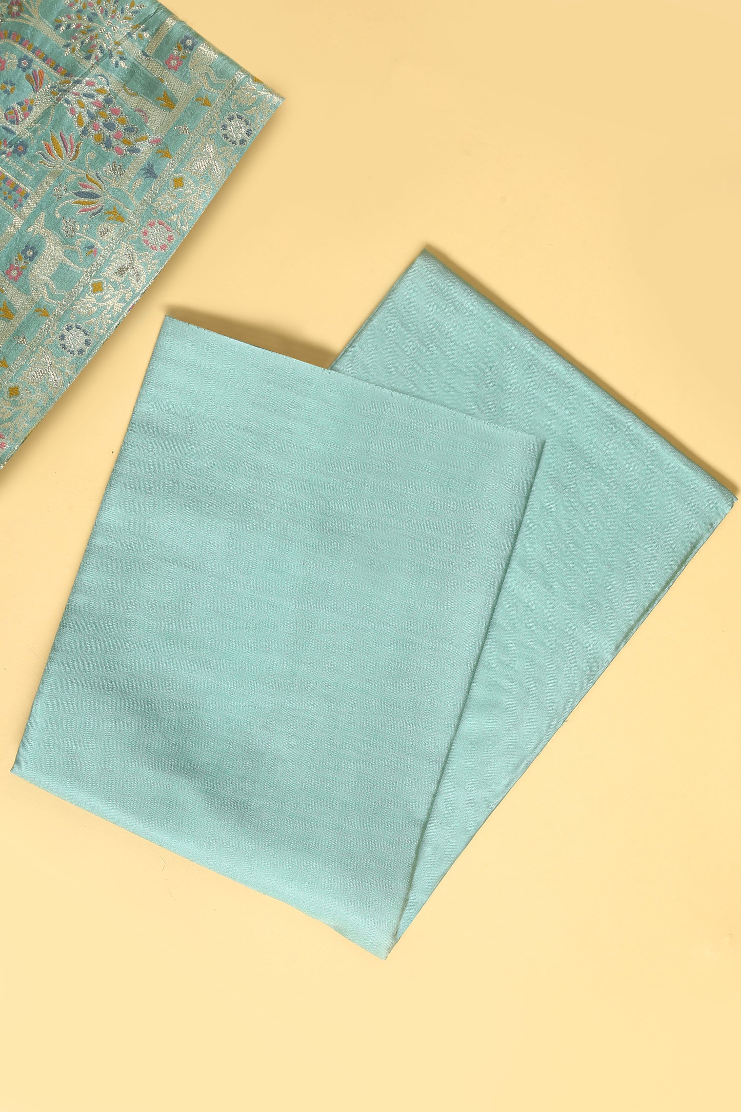 Sea Green Chanderi Silk suit in small motifs all over shirt and dupatta with meenakari work on ghera and border