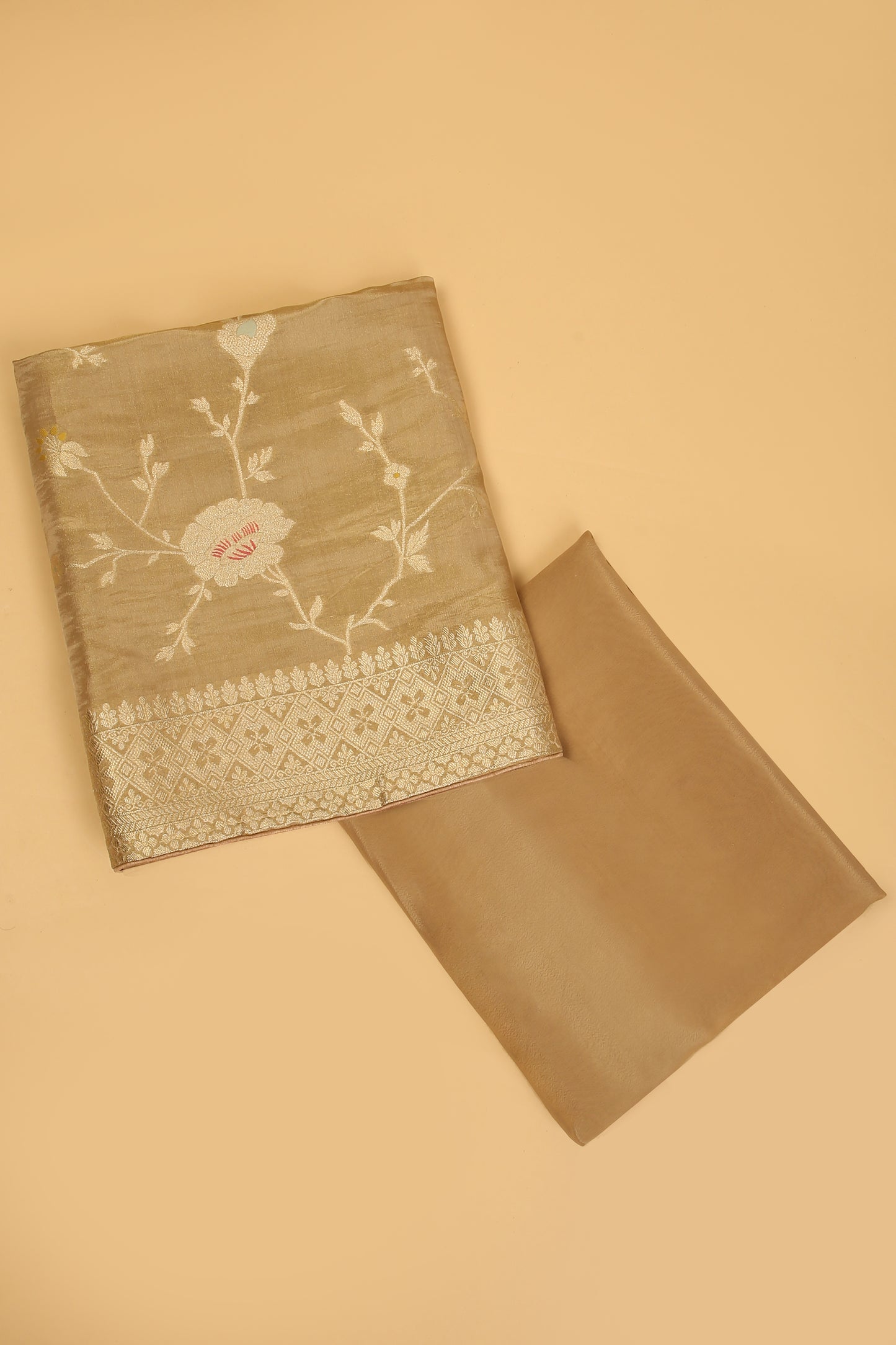 Golden Shimmer Tissue Silk in small buti paired with Floral and Meenakari Zari Weave on Daaman and Dupatta