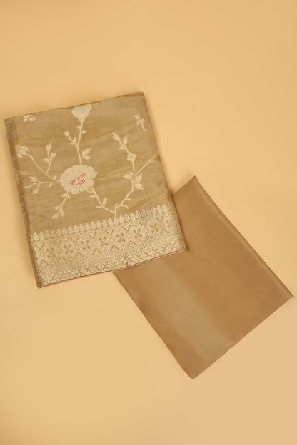 Golden Shimmer Tissue Silk in small buti paired with Floral and Meenakari Zari Weave on Daaman and Dupatta