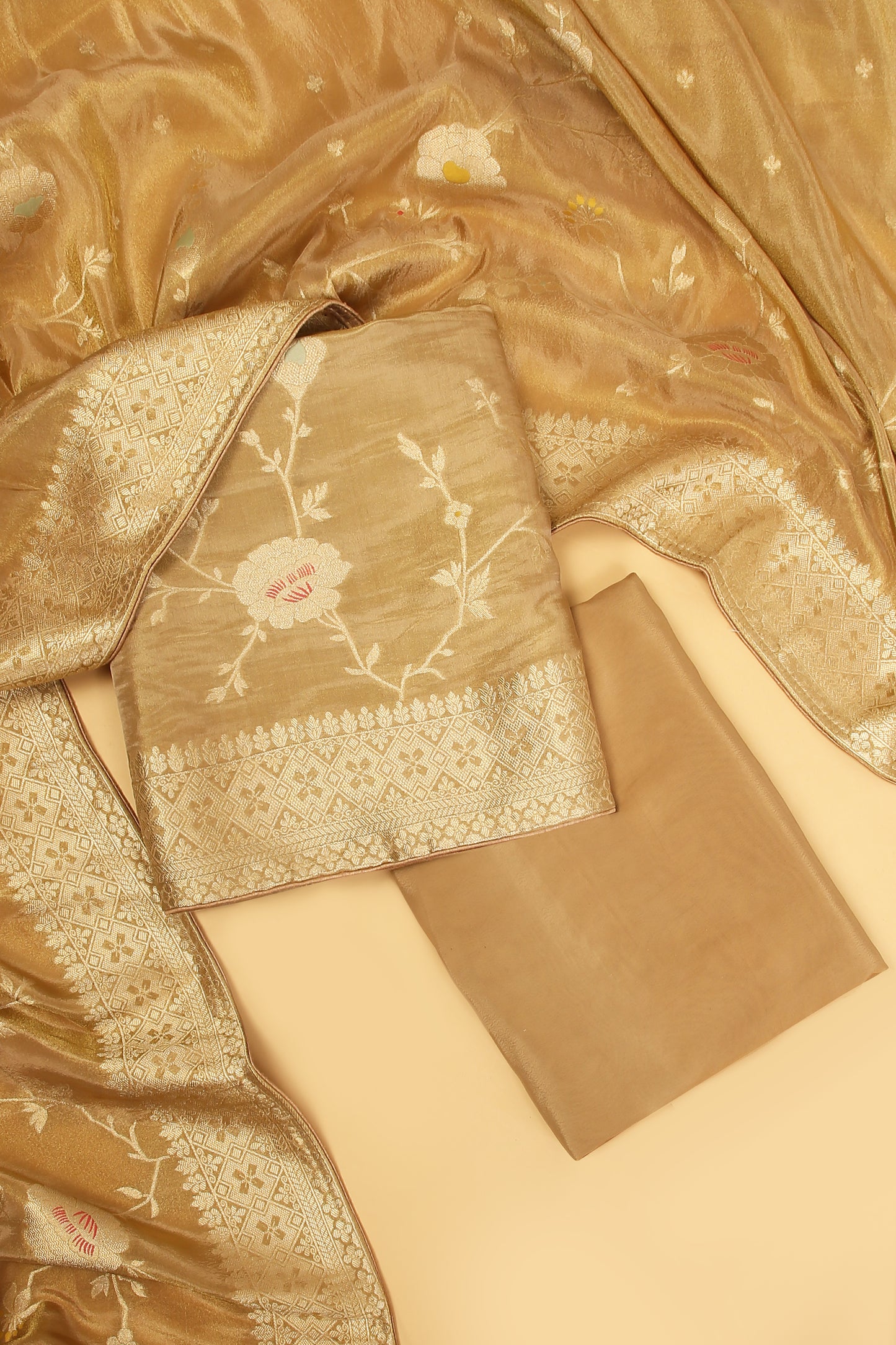 Golden Shimmer Tissue Silk in small buti paired with Floral and Meenakari Zari Weave on Daaman and Dupatta