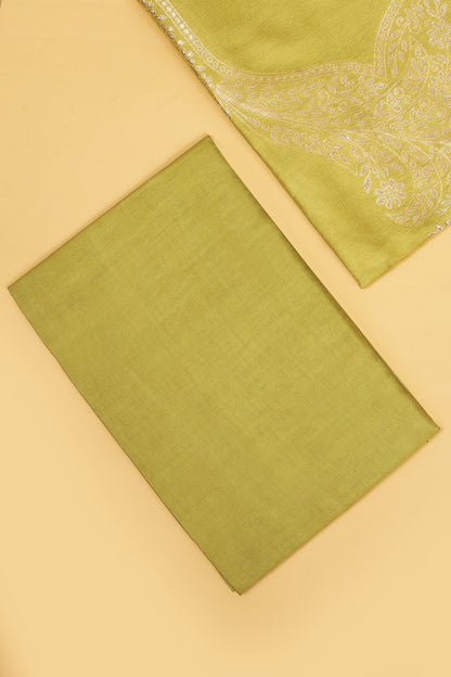 Green Chanderi Silk suit in Neck Design and tradtional motifs on body woven with golden zari and Ombre motif weaved Dupatta giving subtle contrast with shirt