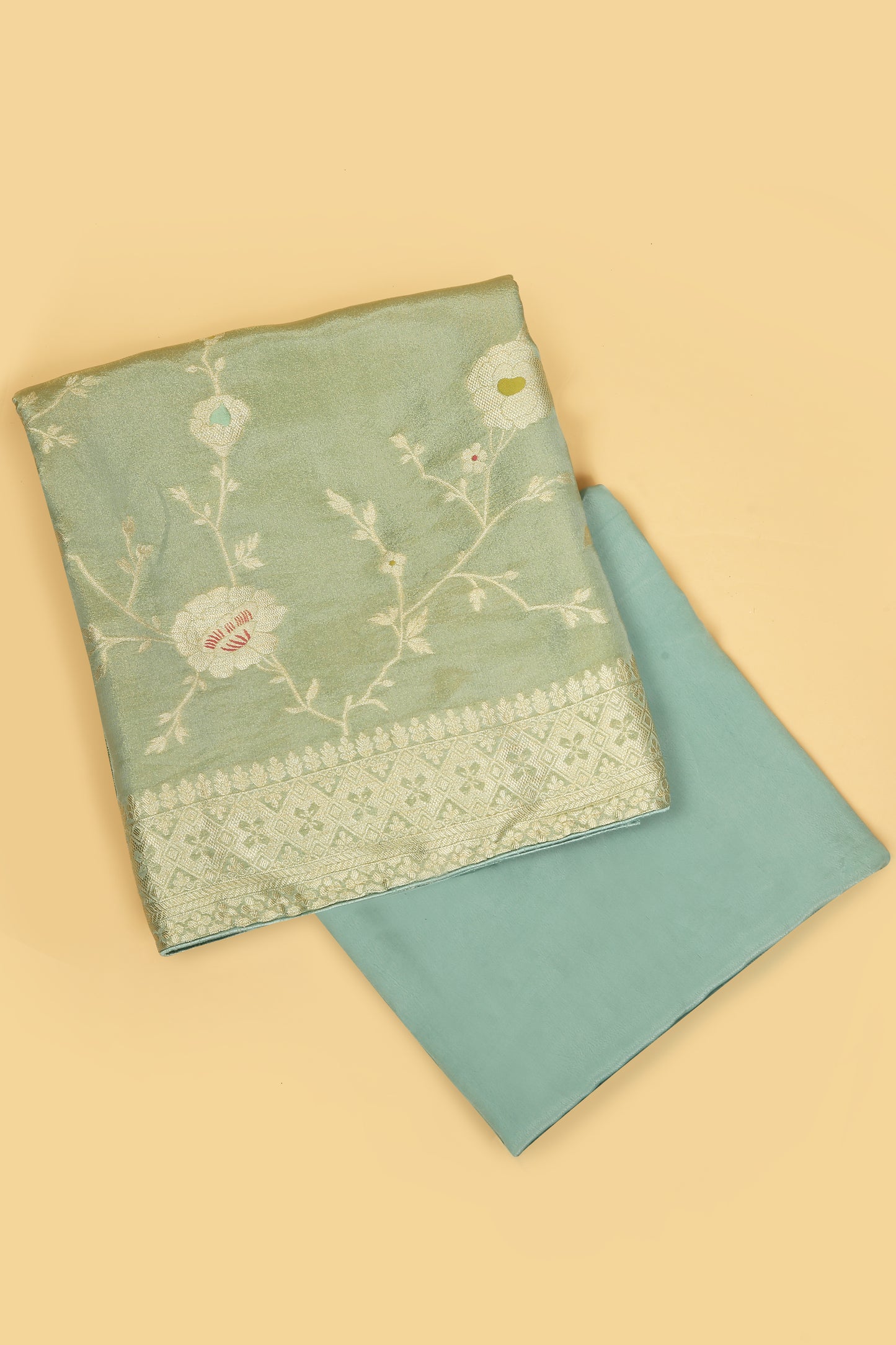 Sea Green Tissue Silk in small buti paired with Floral and Meenakari Zari Weave on Daaman and Dupatta