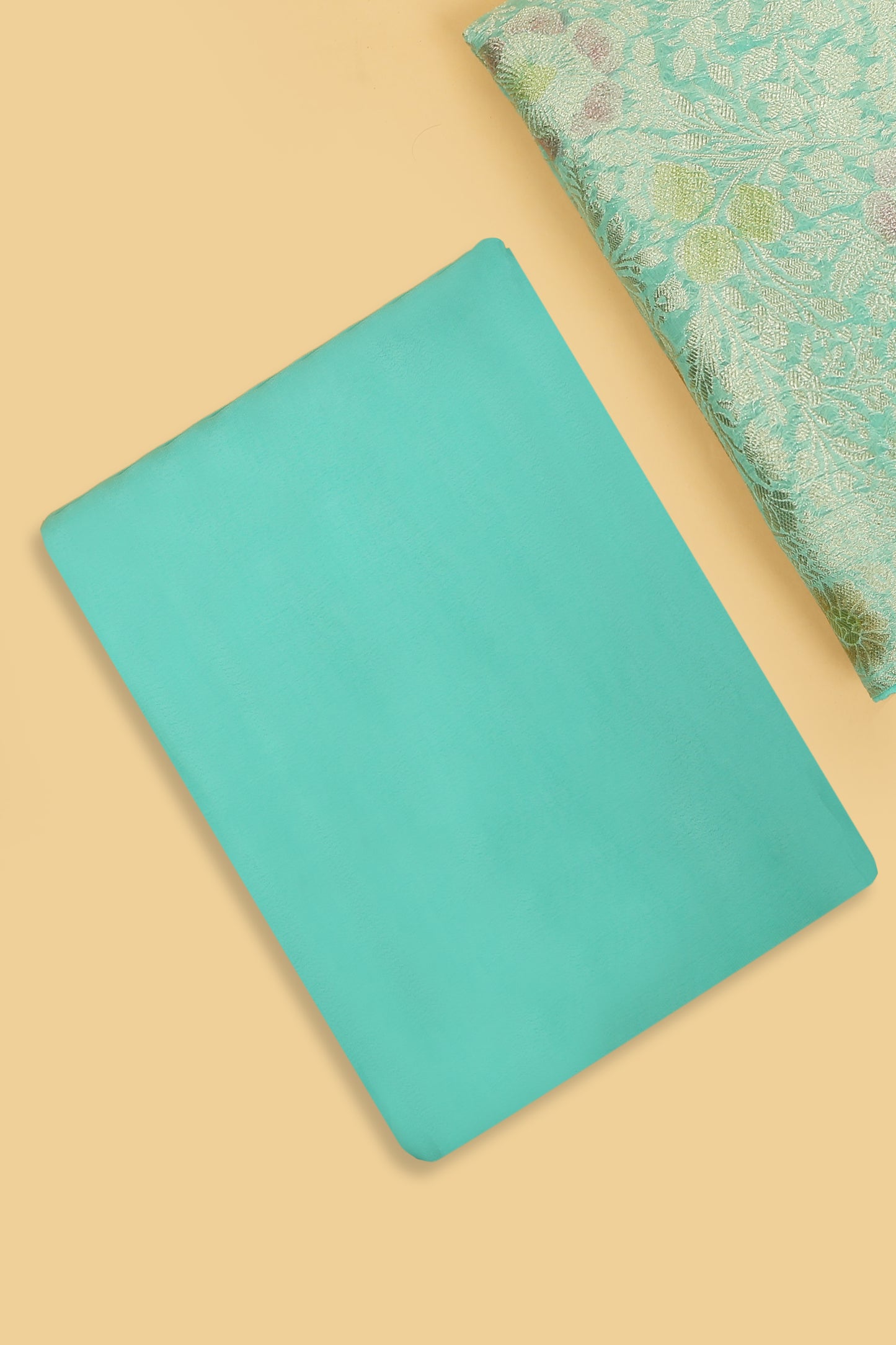 Turquoise Khaddi Georgette Silk Suit in Floral Jaal pattern on shirt and Rangkaat on shirt and dupatta with plain crepe silk bottom