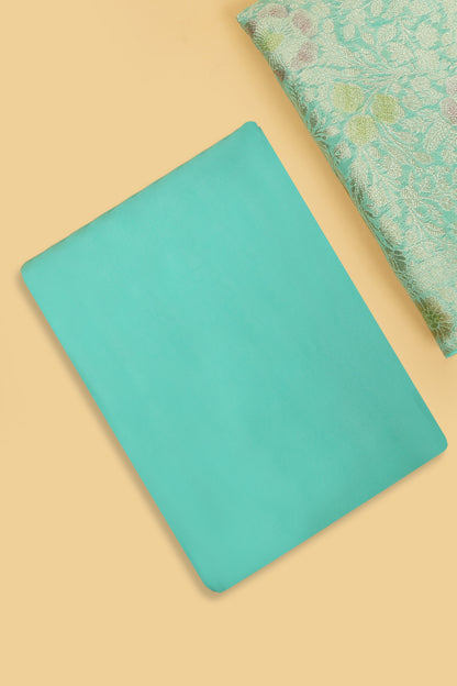 Turquoise Khaddi Georgette Silk Suit in Floral Jaal pattern on shirt and Rangkaat on shirt and dupatta with plain crepe silk bottom