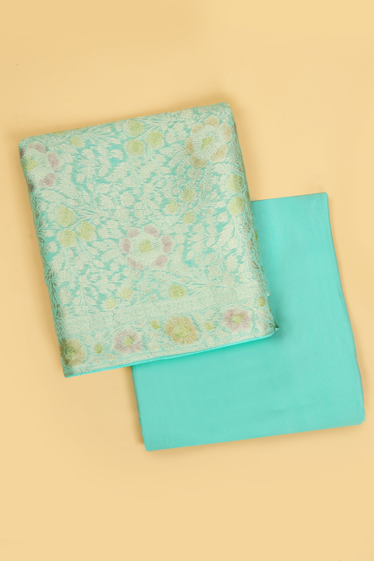Turquoise Khaddi Georgette Silk Suit in Floral Jaal pattern on shirt and Rangkaat on shirt and dupatta with plain crepe silk bottom