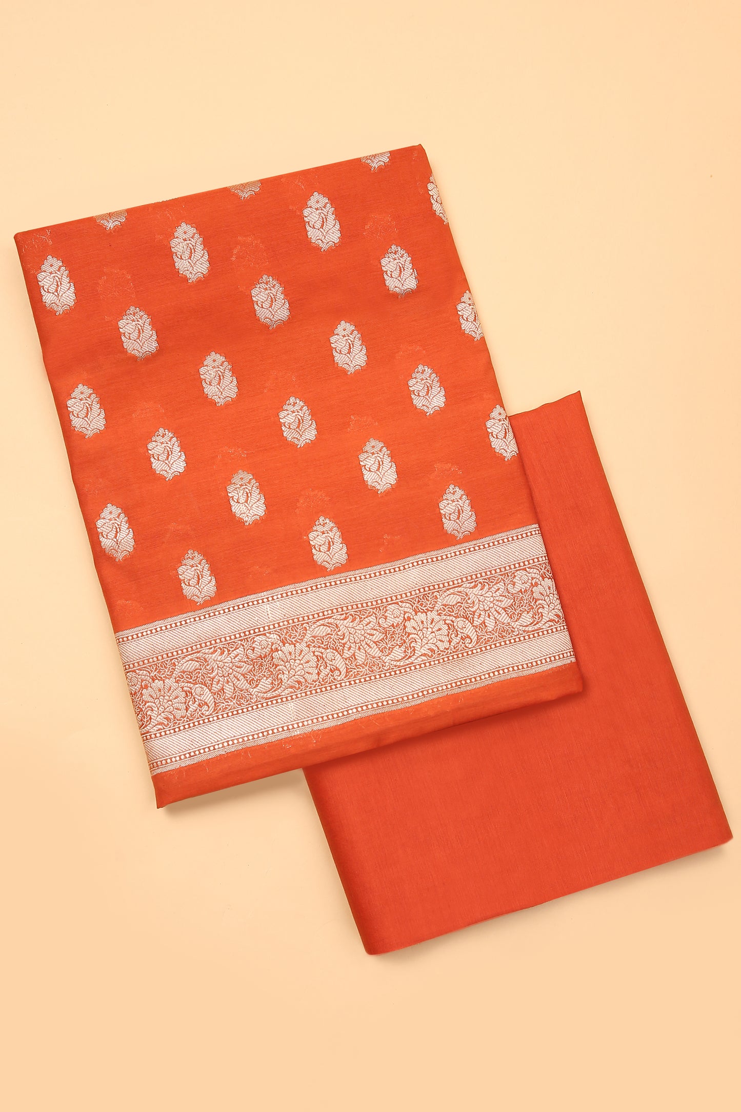 Orange Banarasi Chanderi Silk unstitched suit set in Zari Buti woven shirt with Bandhani and woven dupatta