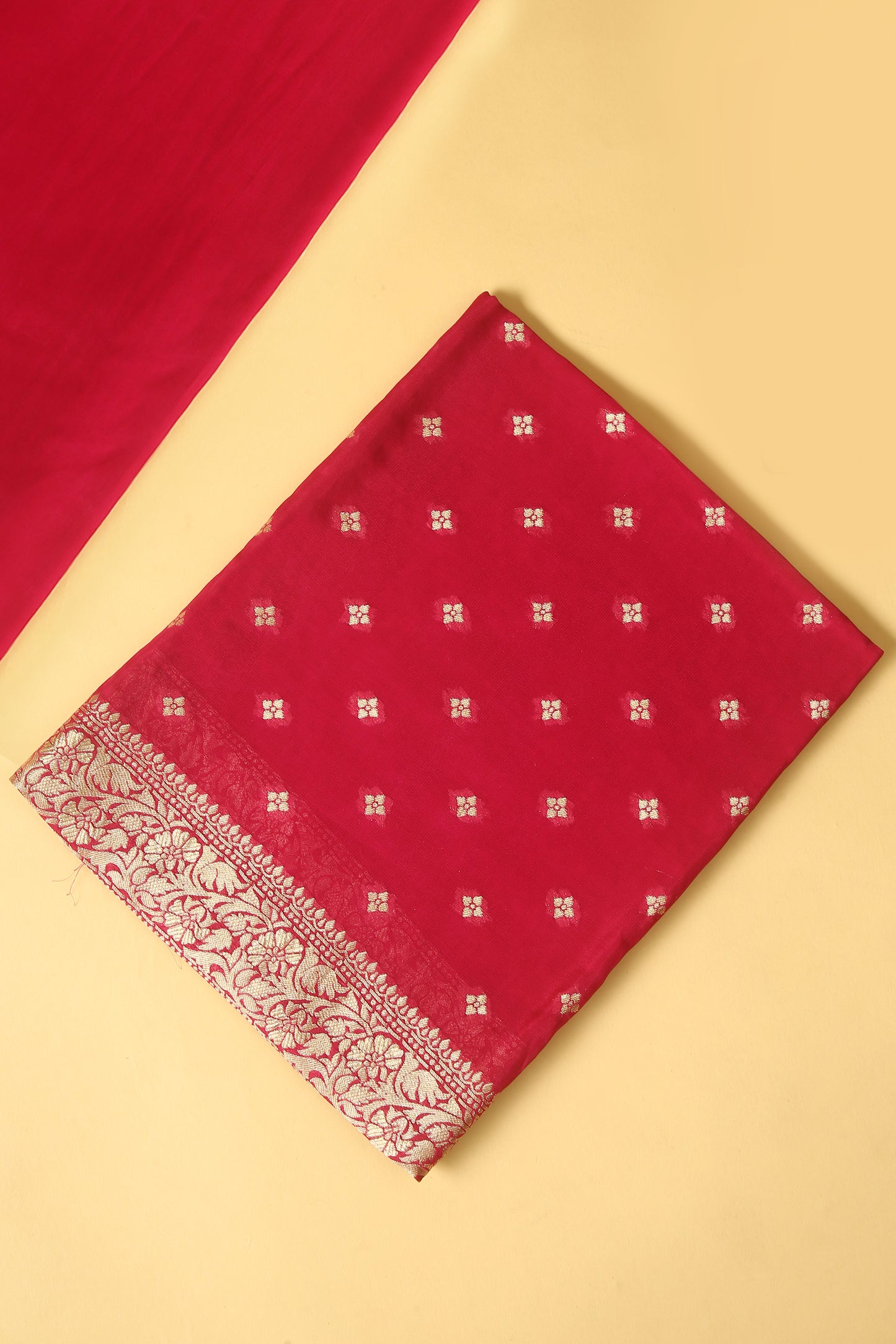 Rani Pink Khaddi Georgette Silk Suit in small buti on shirt and Bandhani Weave dupatta with plain crepe silk bottom