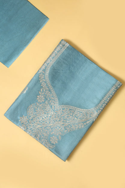 Blue Chanderi Silk suit in Neck Design and tradtional motifs on body woven with golden zari and Ombre motif weaved Dupatta giving subtle contrast with shirt