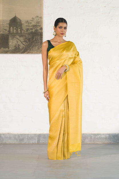 Yellow Soft Silk Saree Woven in Almond Zari within the Fabric giving smooth texture from in and out