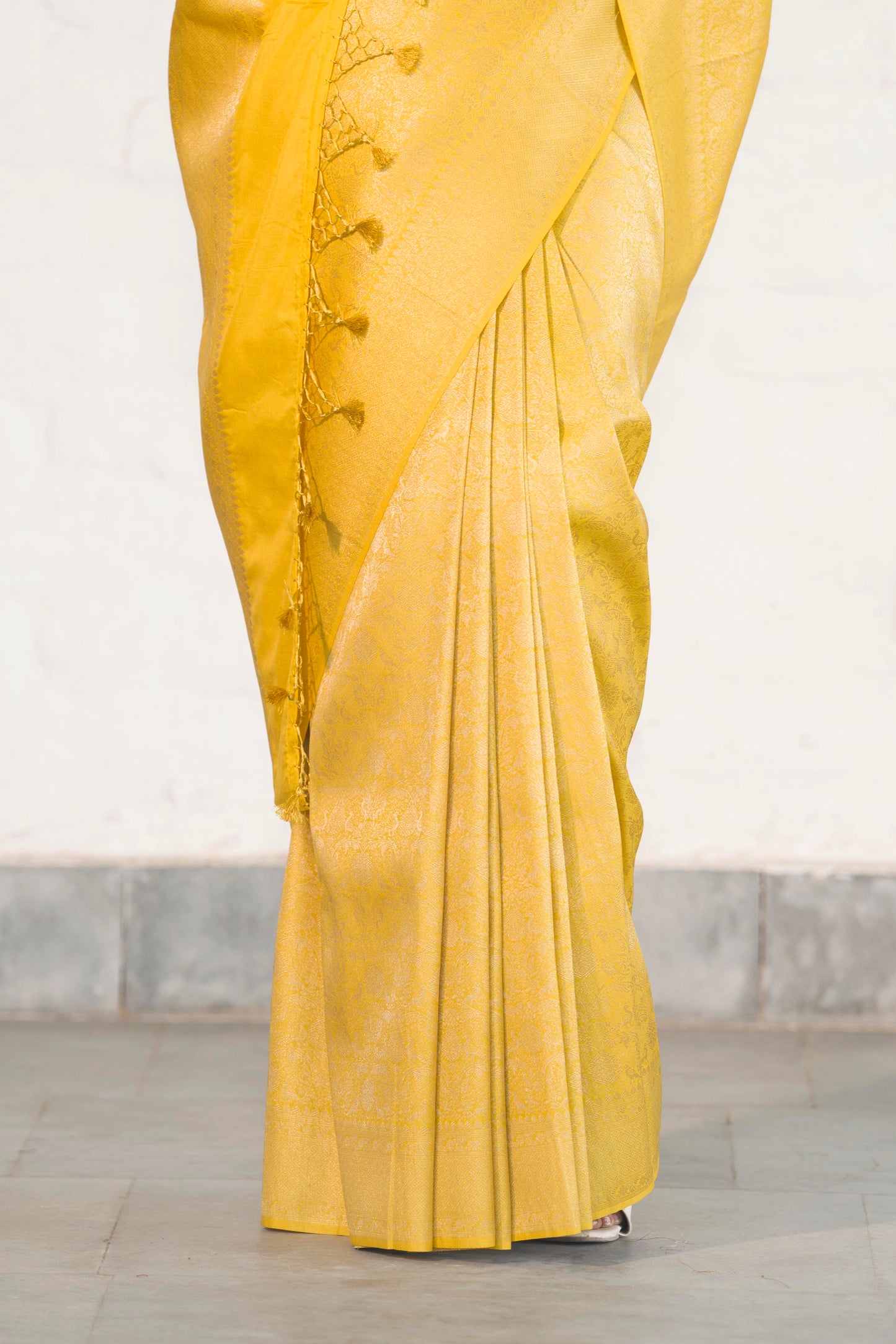 Yellow Soft Silk Saree Woven in Almond Zari within the Fabric giving smooth texture from in and out