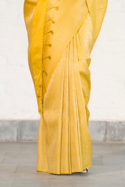 Yellow Soft Silk Saree Woven in Almond Zari within the Fabric giving smooth texture from in and out