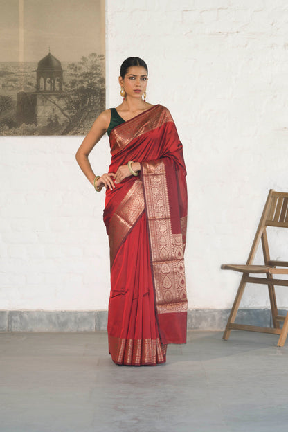 Maroon Plain Blend Silk Saree with traditional border palla and woven blouse