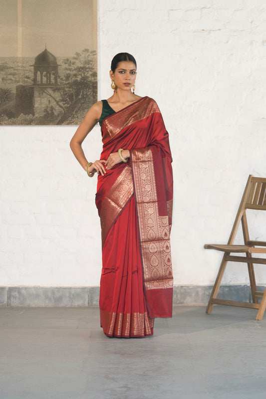 Maroon Plain Blend Silk Saree with traditional border palla and woven blouse