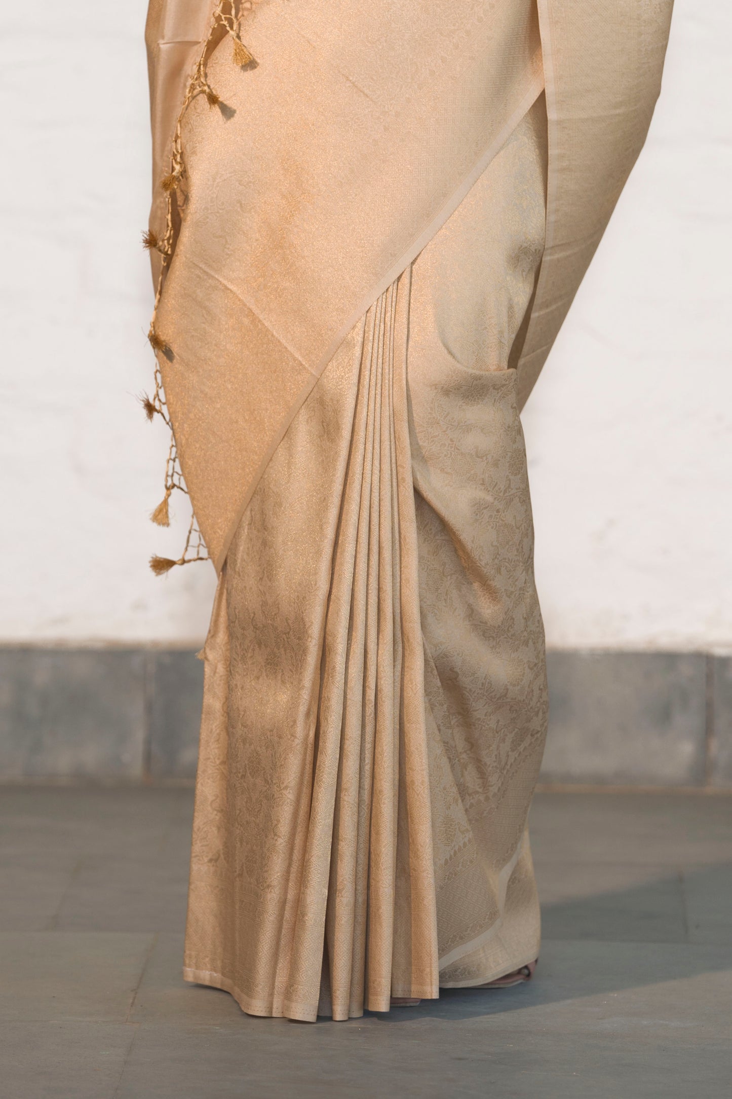 Cream Soft Silk Saree Woven in Almond Zari within the Fabric giving smooth texture from in and out