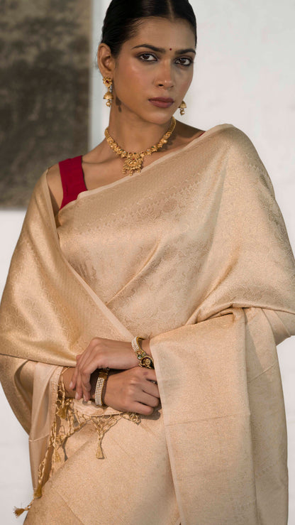Cream Soft Silk Saree Woven in Almond Zari within the Fabric giving smooth texture from in and out
