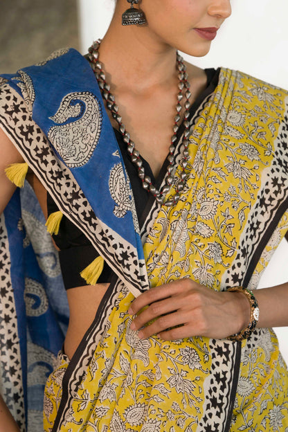 Yellow Mul Cotton Saree with Kalamkari handblock print and contrast handblock palla accesorised with tassels