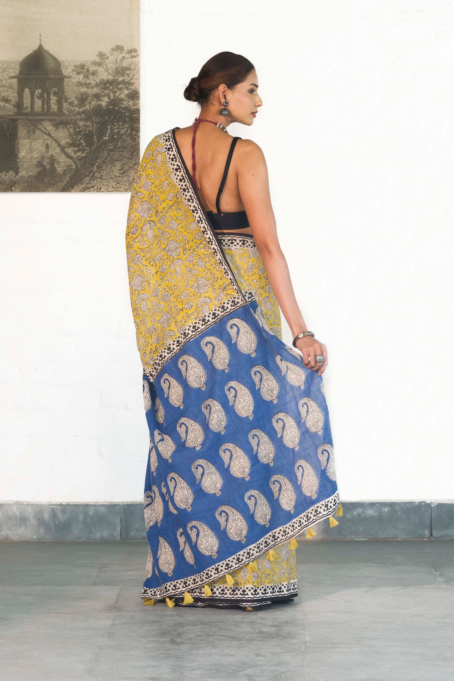 Yellow Mul Cotton Saree with Kalamkari handblock print and contrast handblock palla accesorised with tassels
