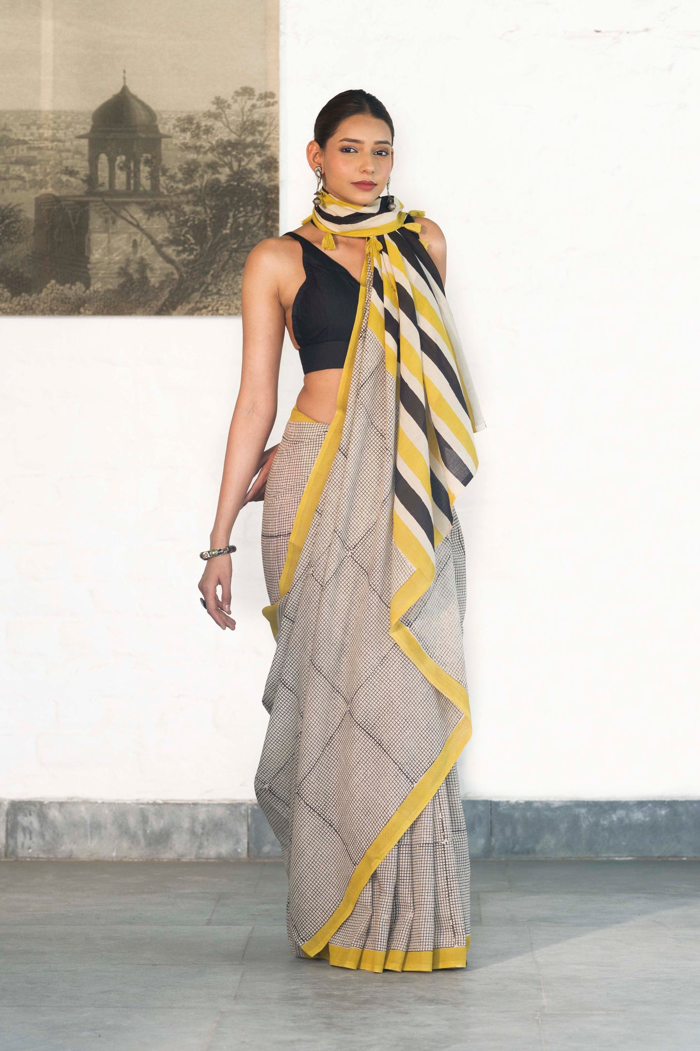 Off White Mul Cotton Saree with small checks handblock print and striped design palla accesorised with tassels