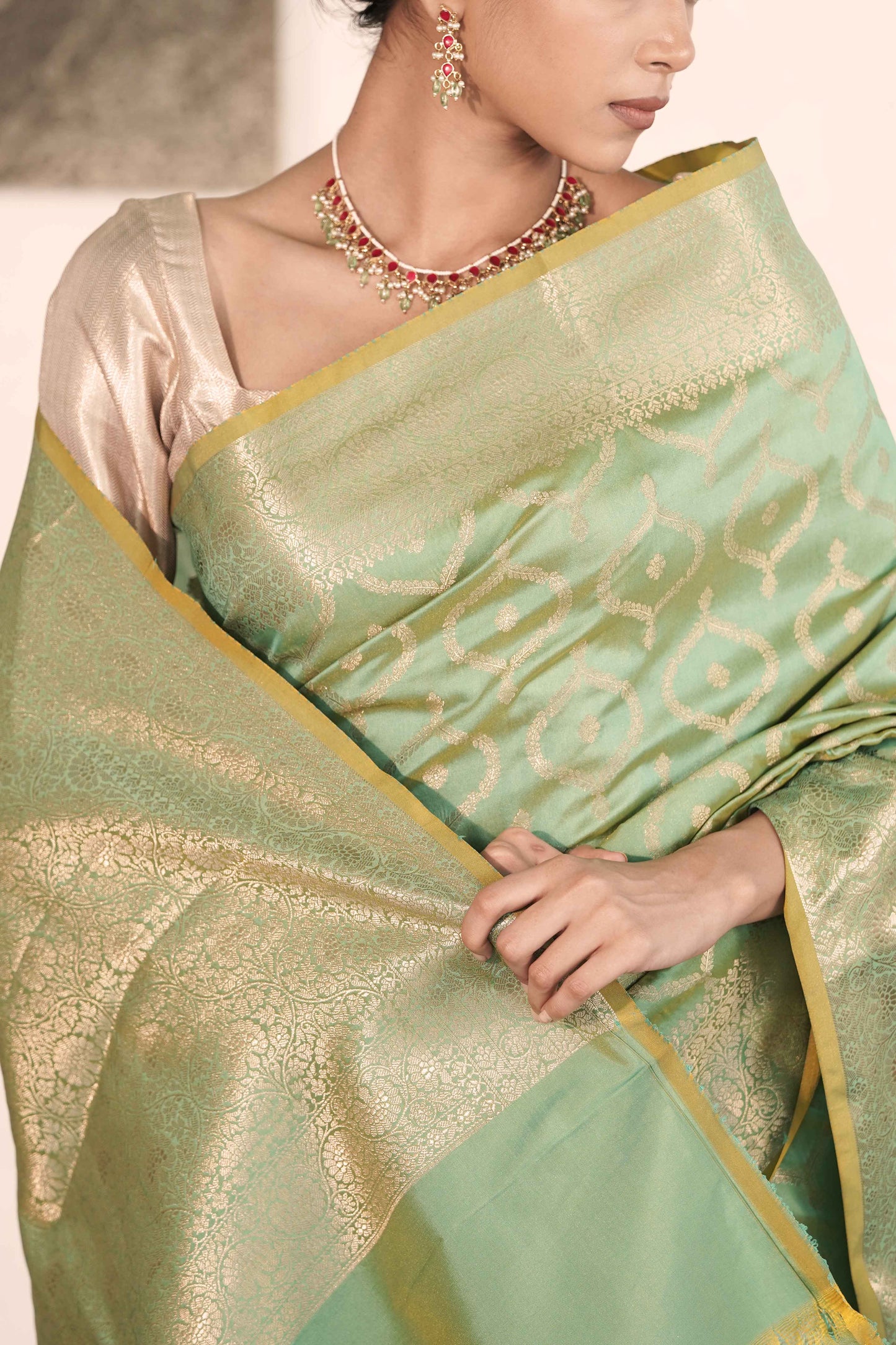 Green Dual Tone Banarasi Silk Saree woven in Necklace Buta all over body and Rich Golden Zari Palla