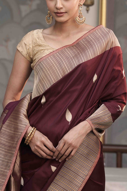 Brown Pure Banarasi Katan Silk Saree with Leaf Swaying motif and vertically  stripe designed Marvelous Border Palla
