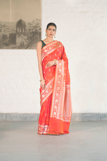Orange Mashru Silk Saree woven in Leaf inspired butis across body paired with Floral bel border