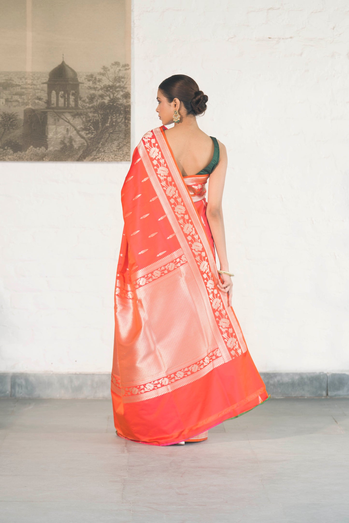 Orange Mashru Silk Saree woven in Leaf inspired butis across body paired with Floral bel border