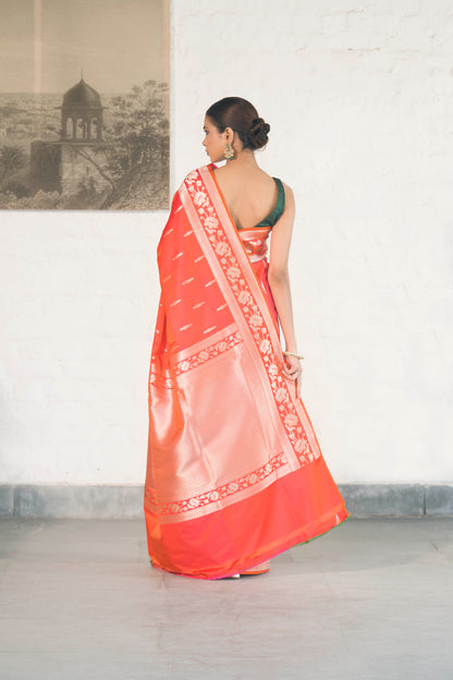 Orange Mashru Silk Saree woven in Leaf inspired butis across body paired with Floral bel border