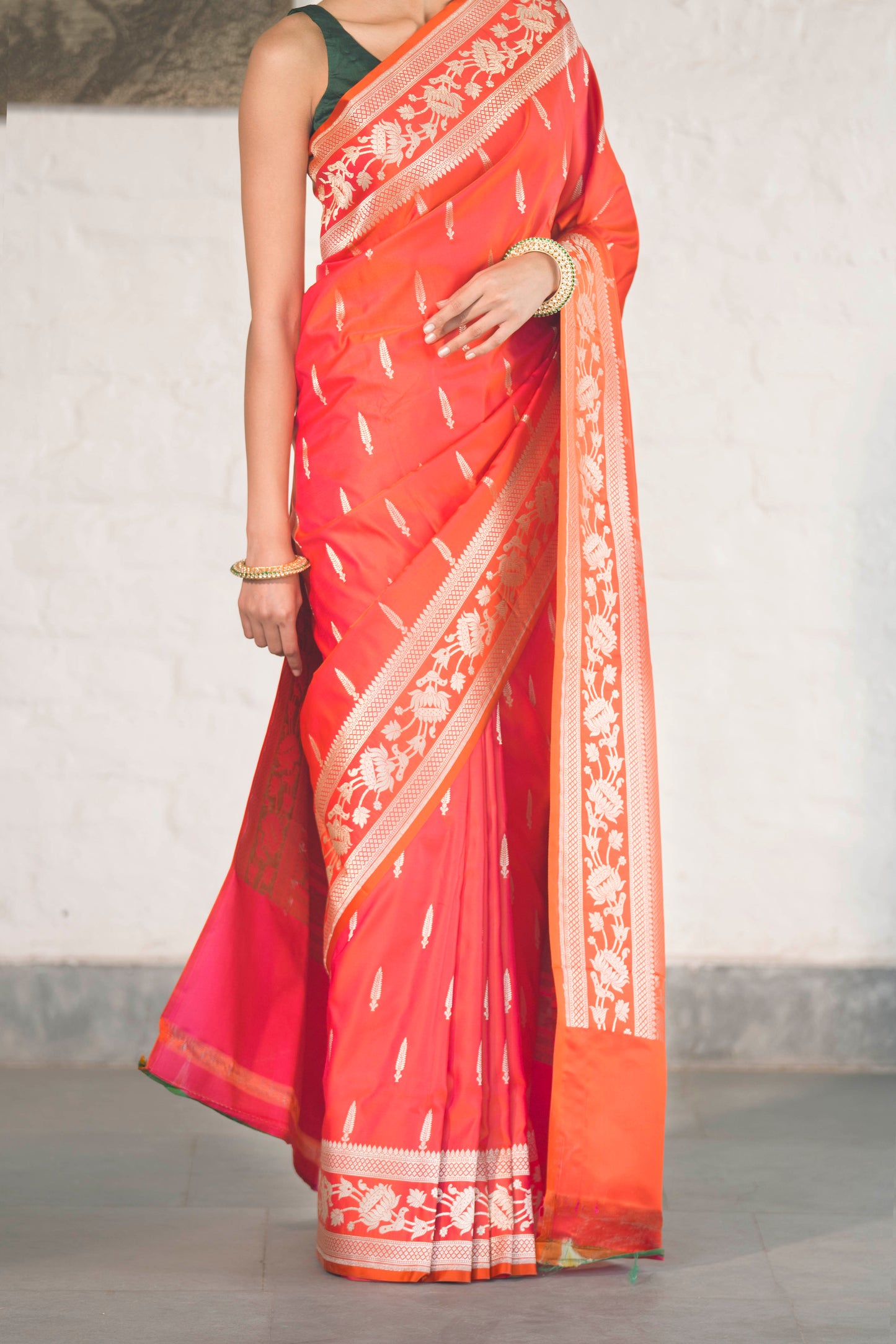 Orange Mashru Silk Saree woven in Leaf inspired butis across body paired with Floral bel border