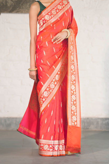 Orange Mashru Silk Saree woven in Leaf inspired butis across body paired with Floral bel border